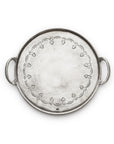 The Vintage Pewter Round Tray With Handles by Faire features a decorative floral-etched inner rim, two side handles, a round shape, and a subtly textured silver finish. Handmade in Italy.