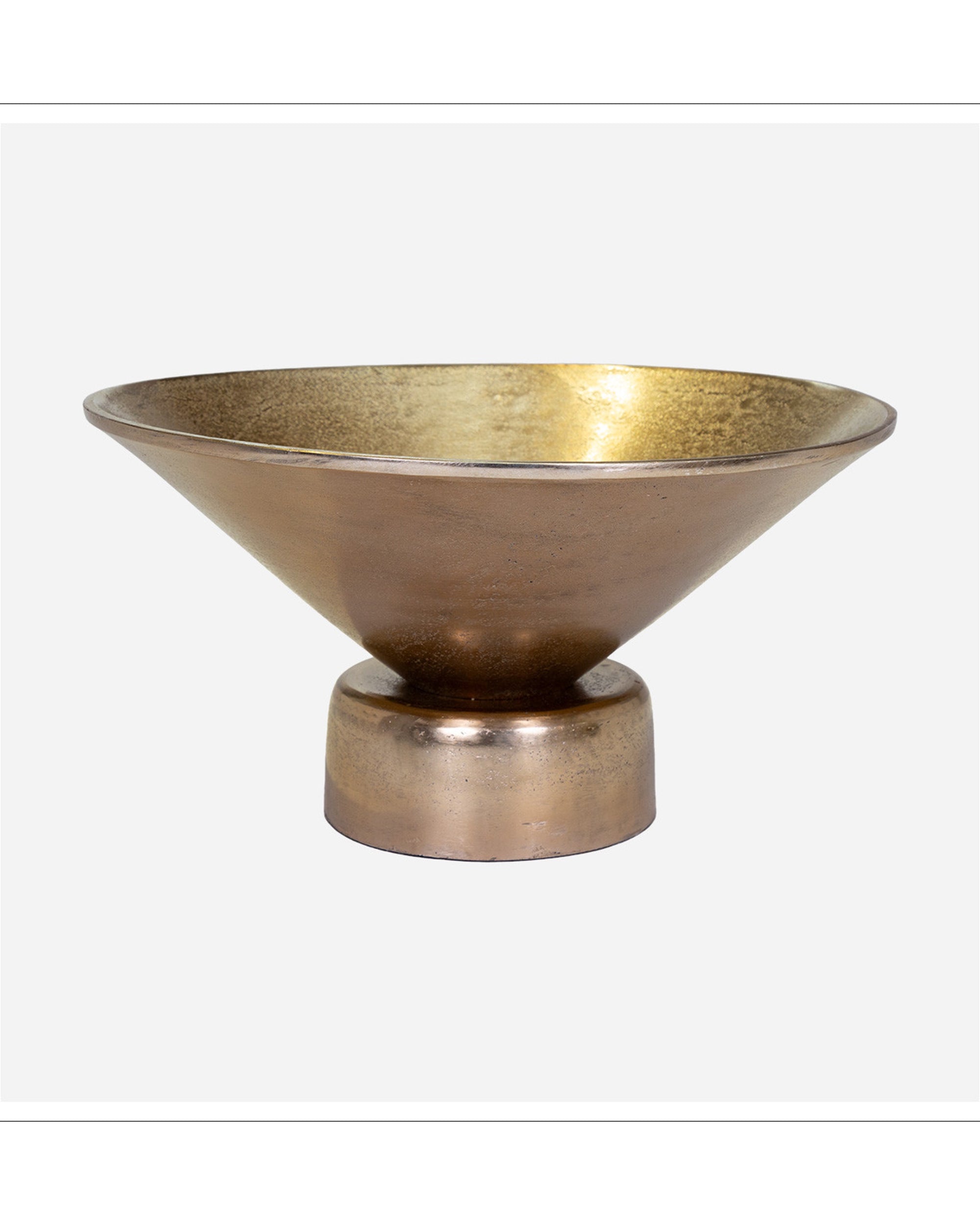 The Import Collection’s 15-723 Vivar Bowl features a wide, shallow gold aluminum design with a bronze exterior and short cylindrical base. This modern pedestal bowl makes an elegant centerpiece against any setting.