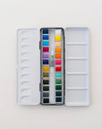 The Faire Watercolor Paint Palette is a portable set that includes a refillable water brush and paintbrush.