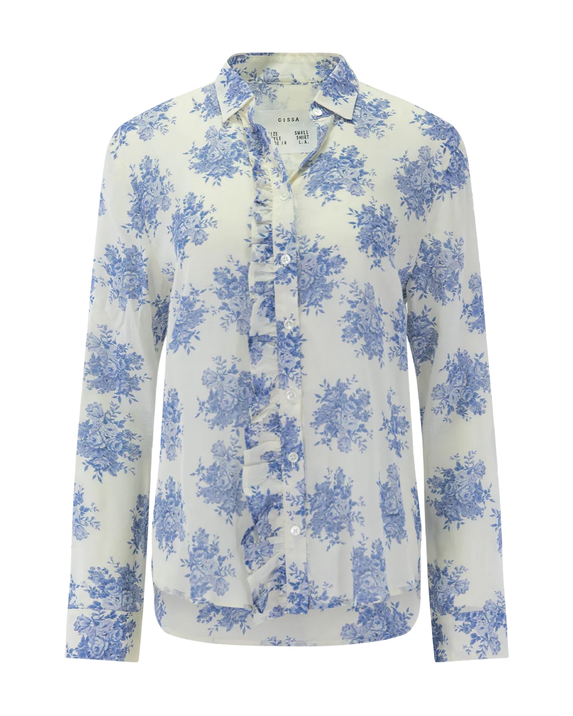 The Waterfall Shirt by Cissa is a long-sleeve, button-up blouse with a white base and light blue floral print, featuring Trocas shell buttons, a collar, and a curved hem.
