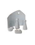 The Accent Decor Claro Nativity Set features a minimalist light gray ceramic design with a star backdrop, two standing figures, baby in manger, and animal—an elegant modern centerpiece for the holidays.
