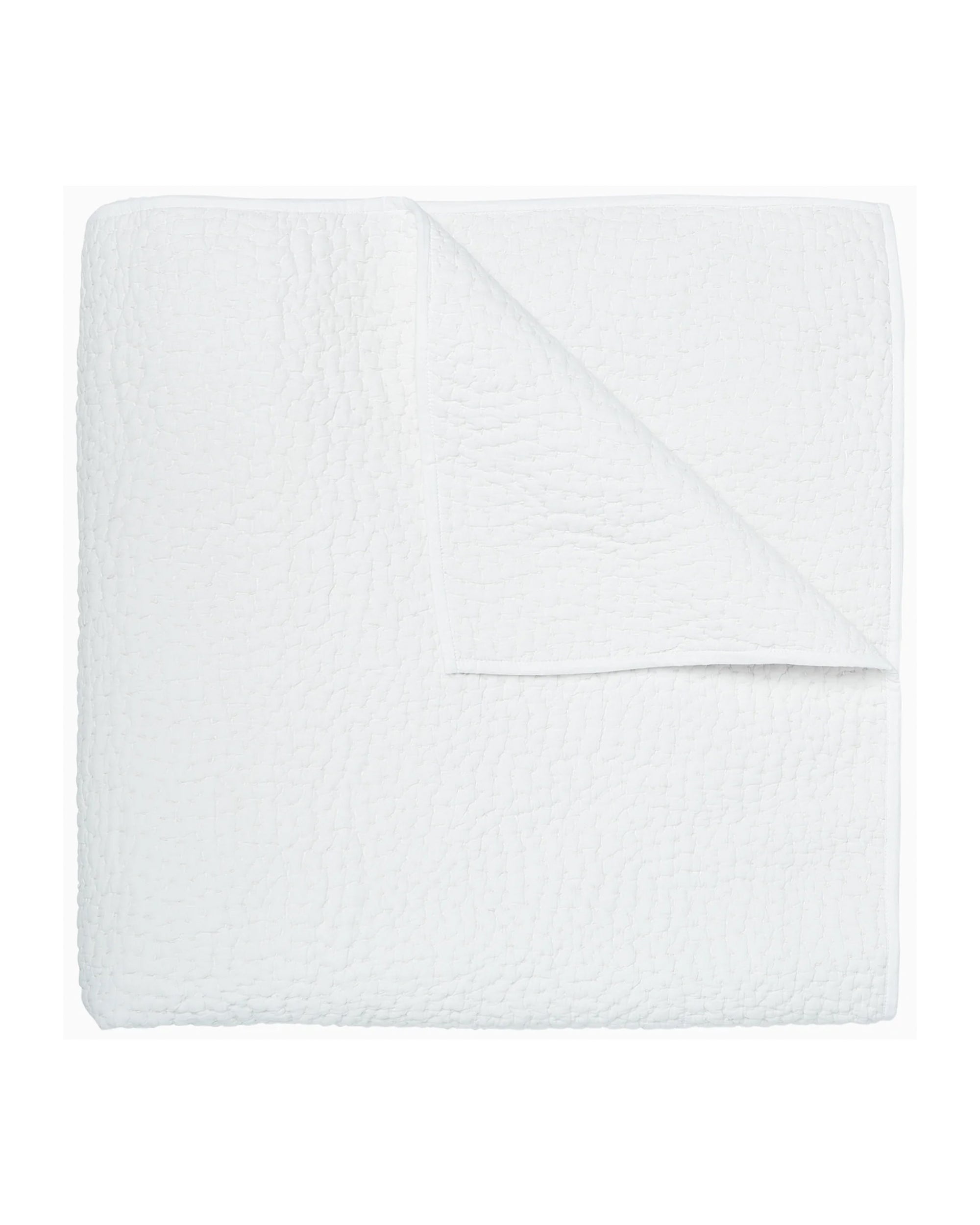 The John Robshaw Coverlet Twin, crafted from soft organic cotton with a white textured finish and a neatly turned-down corner, is displayed on a plain white background.