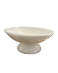The BIDK Home White Resin Bowl 17.7" features a wide, shallow design with a pedestal base and glossy finish, offering a modern and elegant accent perfect for contemporary spaces.