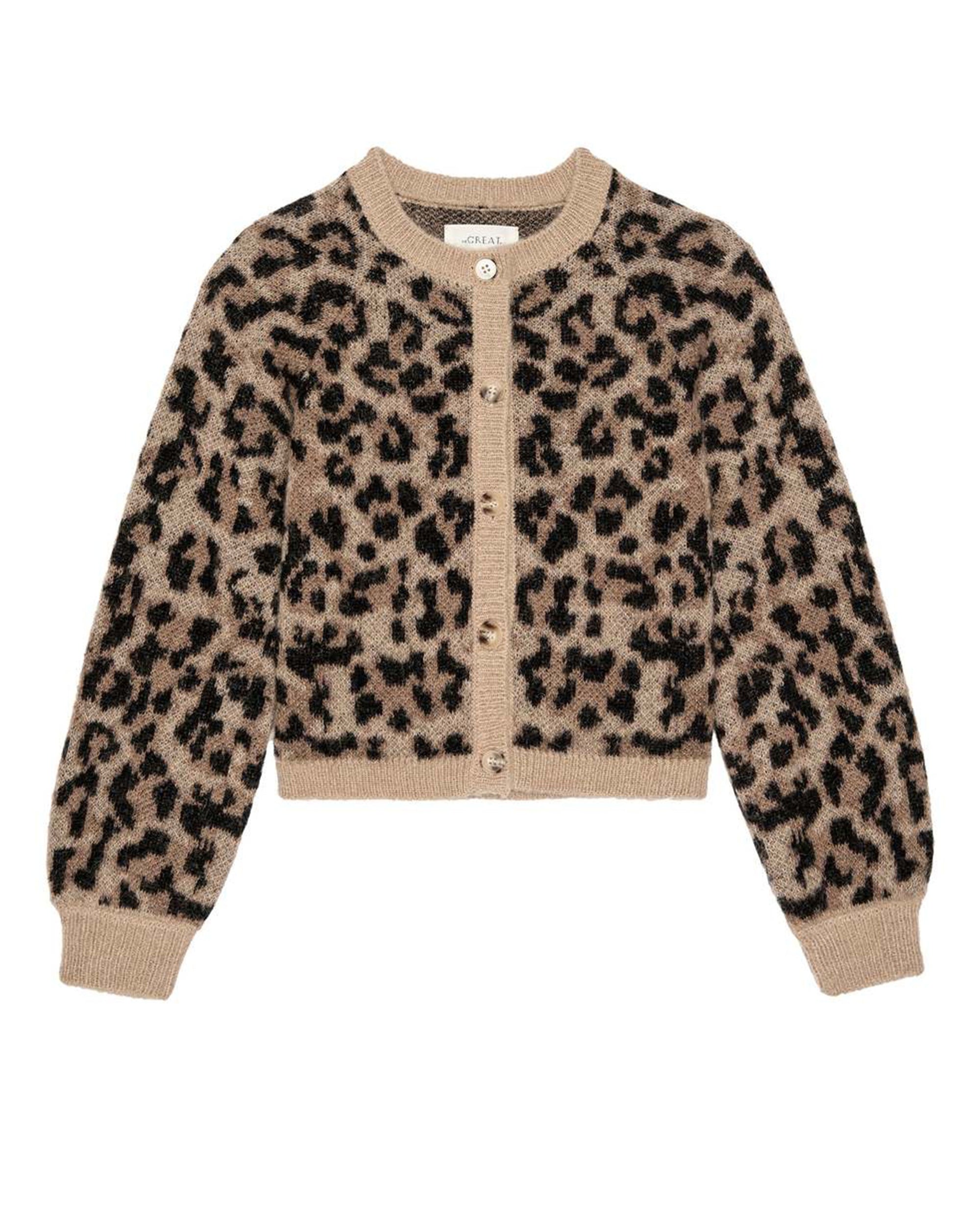 The Windsor Cardigan by The Great Inc. is a beige cropped alpaca cardigan with a black and brown leopard print, long sleeves, ribbed cuffs and hem, button-down front, and is crafted with recycled polyamide and superfine alpaca for softness.