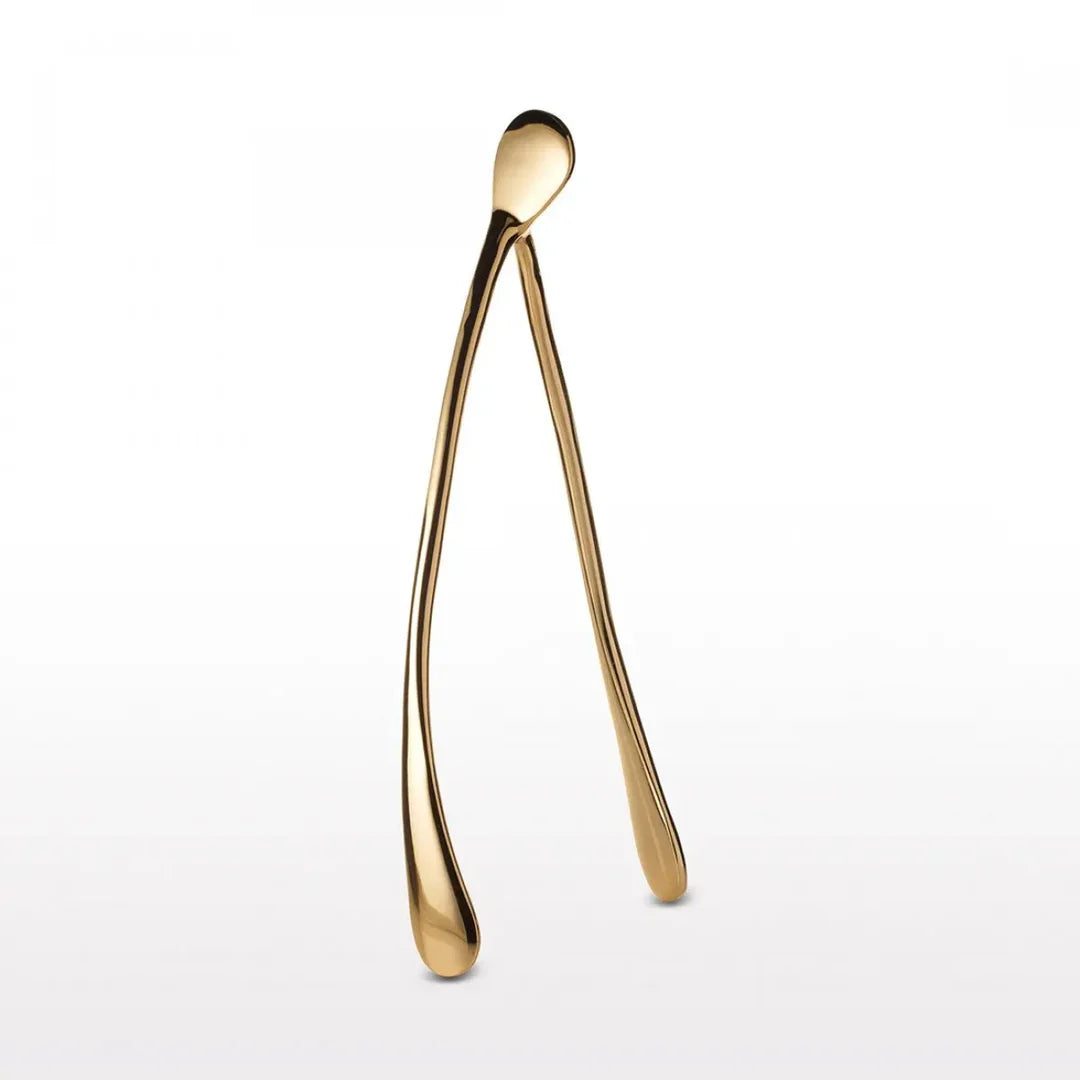 The Faire Wishbone /Large is a gold-colored decor piece that stands upright on a plain white background, making a unique handcrafted gift or elegant home accent.
