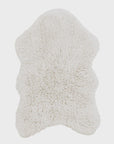 A soft, white, Woolable Sheepskin Rug with an irregular, organic shape by Lorena Canals. The rug has a fluffy texture and appears to be quite plush, making it suitable for adding comfort and warmth to a living space. This eco-friendly rug stands out against the plain background, enhancing its visibility and appeal.