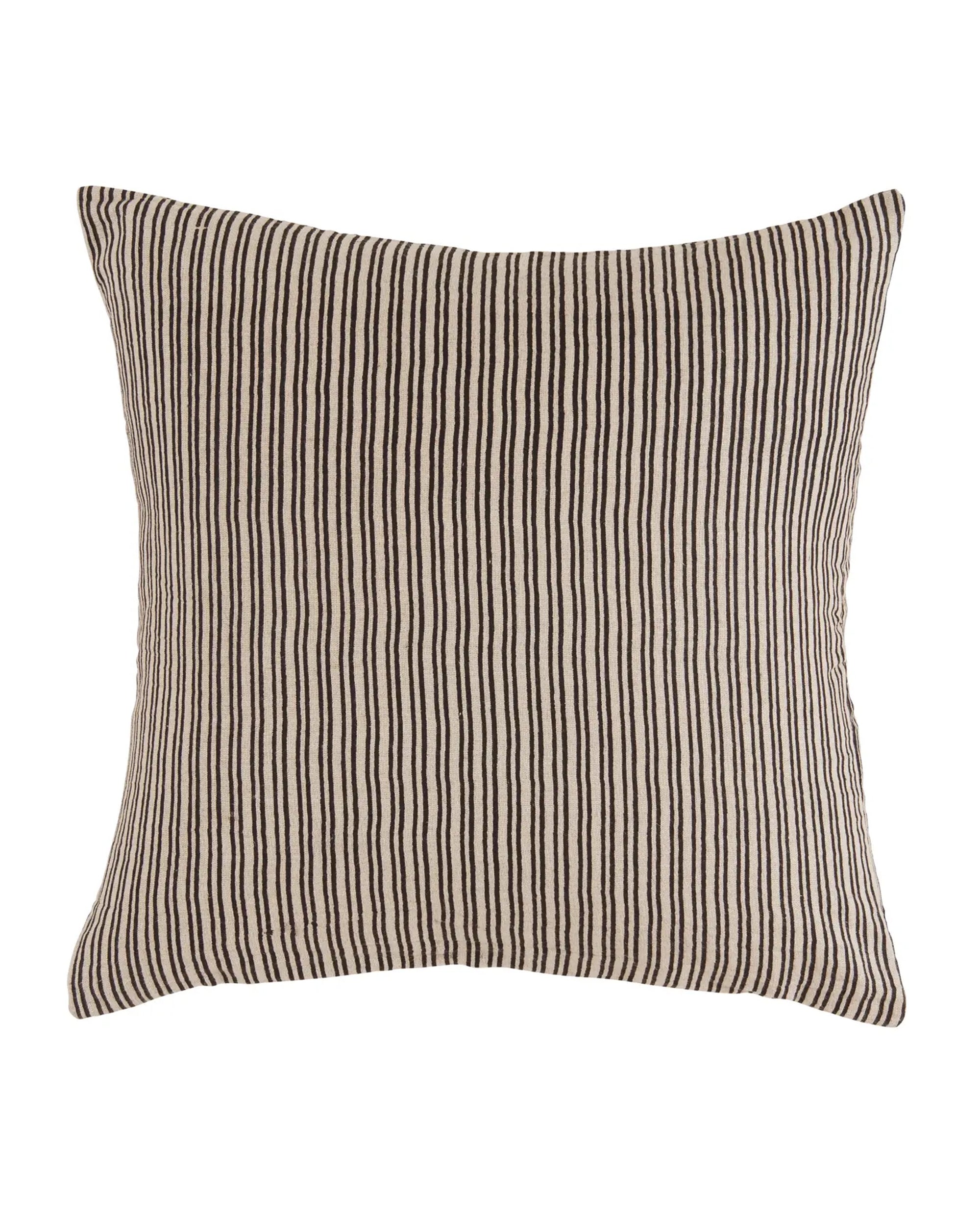 The Liam & Lana Black Wren Pillow 24x24 features a beige linen background with slim vertical black stripes, offering a soft, plush feel and a modern look—an ideal decorative accent for contemporary home decor.