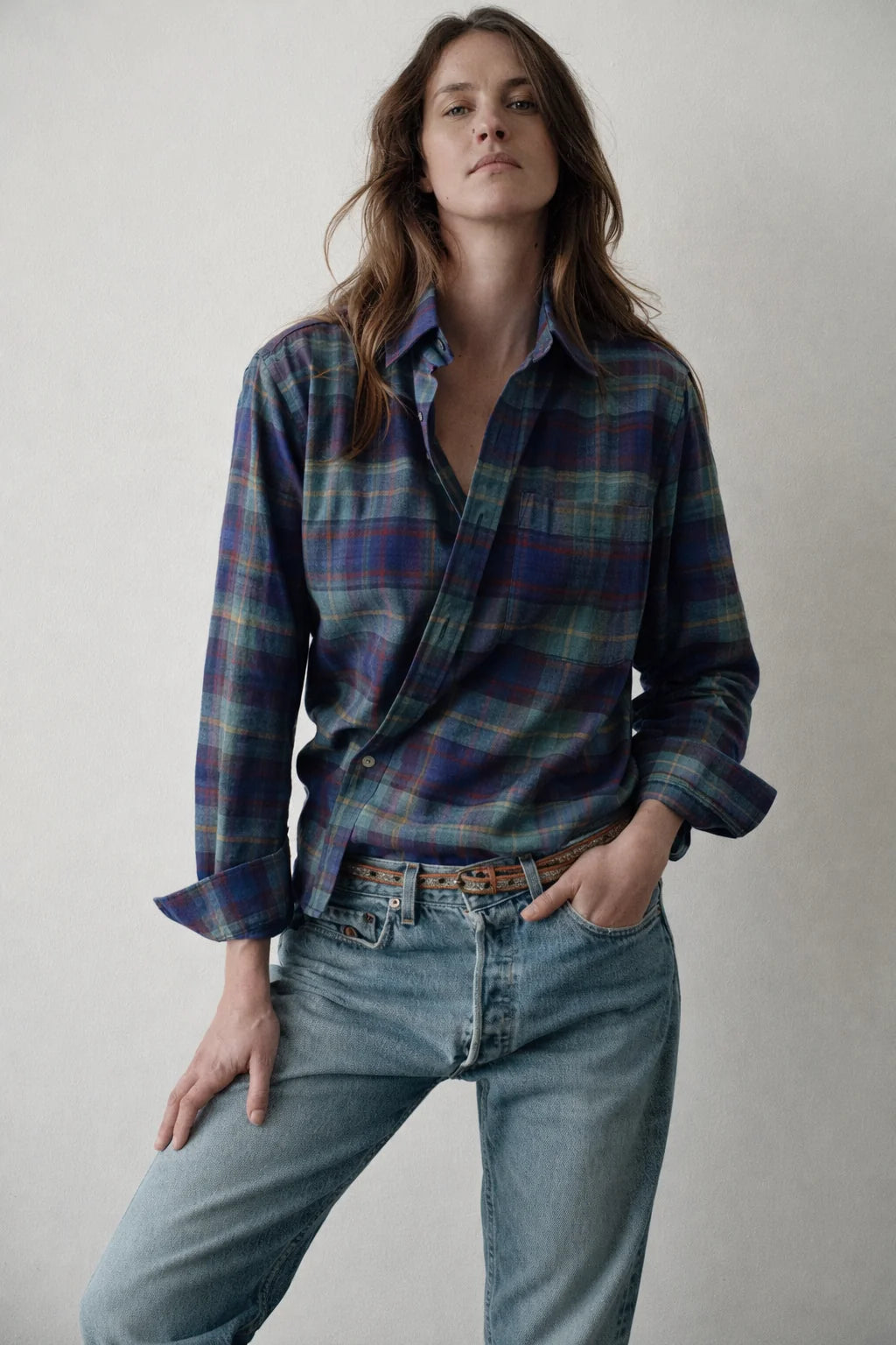 Blue plaid The Daily Shirt by Cissa, styled with light jeans on a minimal backdrop for Bungalow Furniture &amp; Accessories.