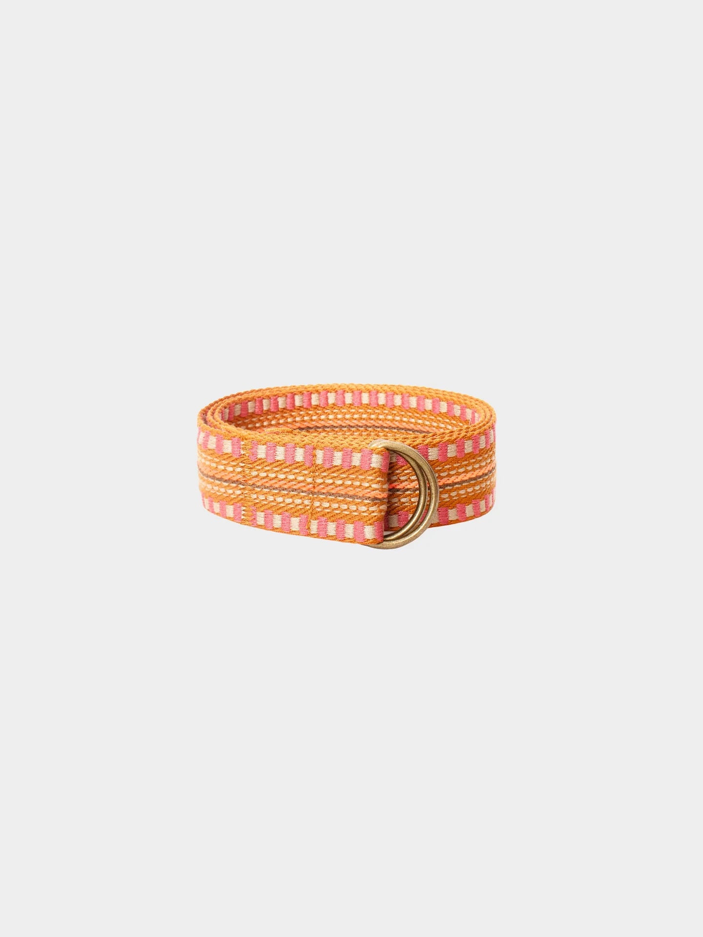 The Stevie Belt by Xirena is a vintage-inspired textured belt with orange, pink, and yellow stripes and a double gold ring buckle, shown against a plain white background.