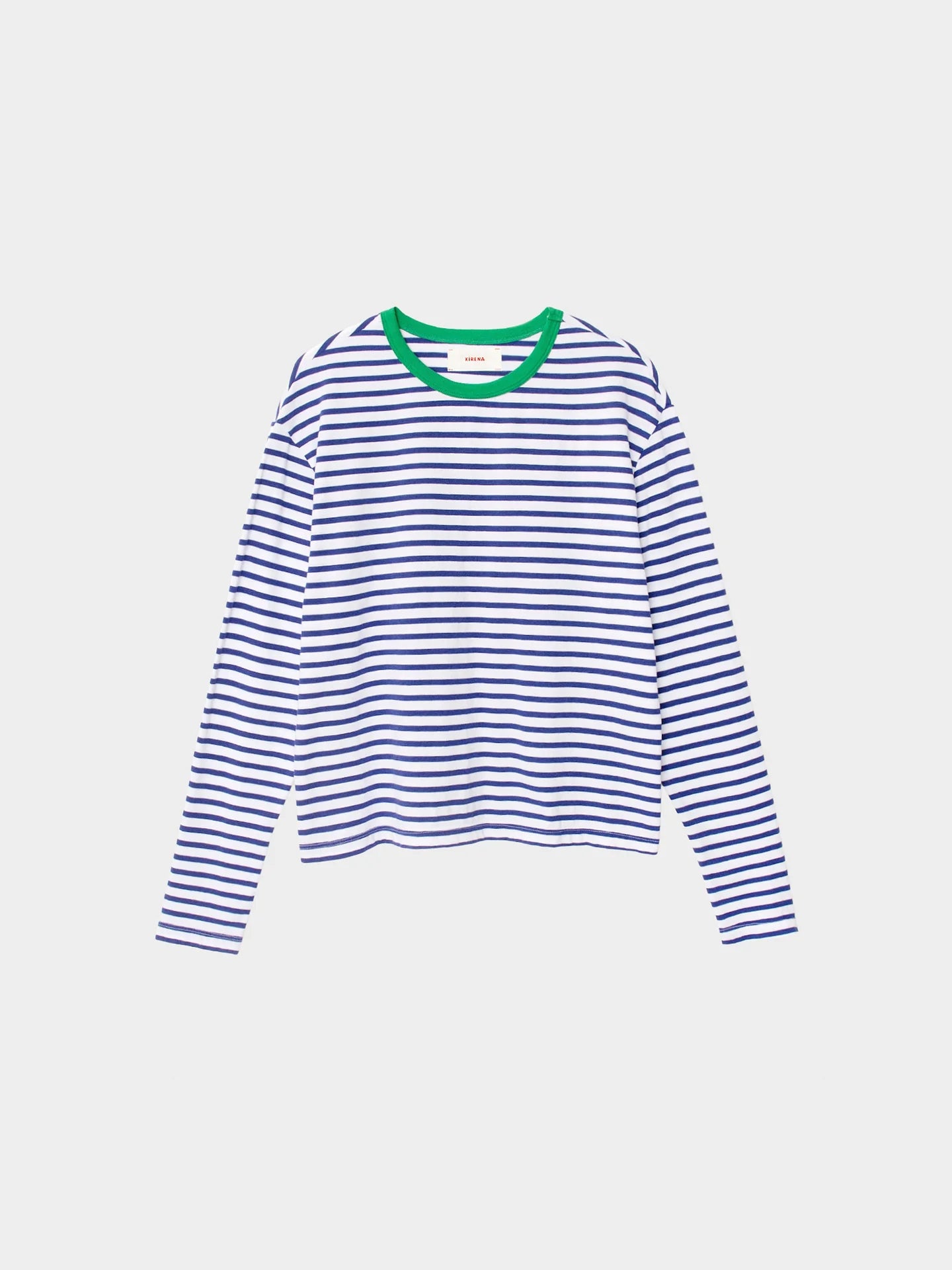 The Terrance Tee by Xirena features navy and white stripes, a green crew neckline, and a boxy fit in soft cotton jersey. Shown on a plain white background.