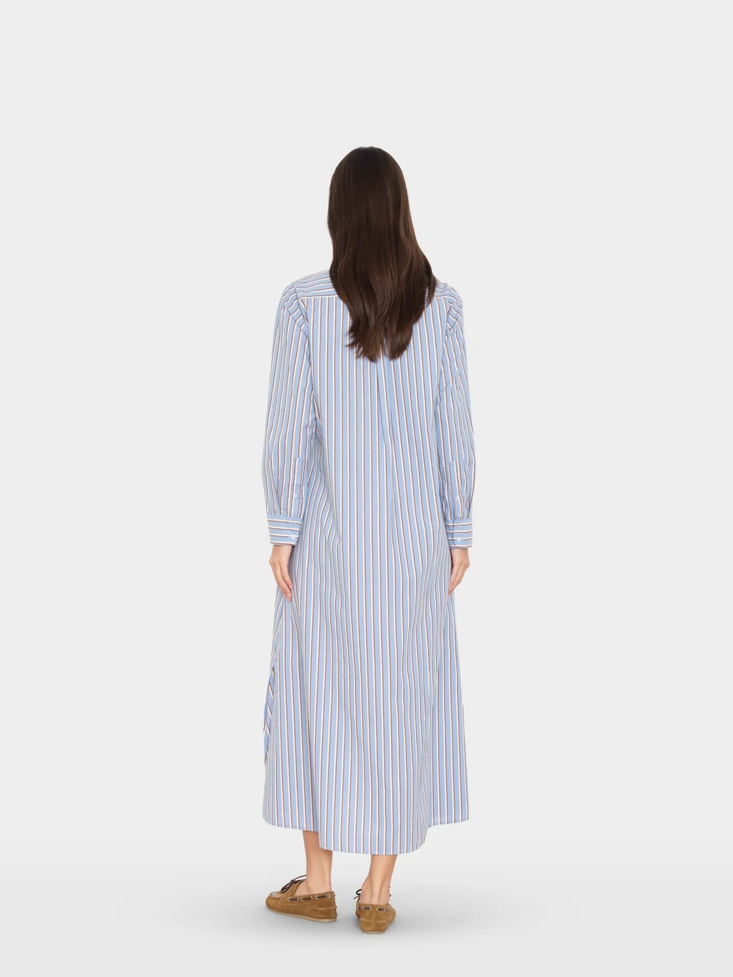 Blue-and-white striped long-sleeve dress with front buttons by Xirena, styled for Bungalow Furniture &amp; Accessories.