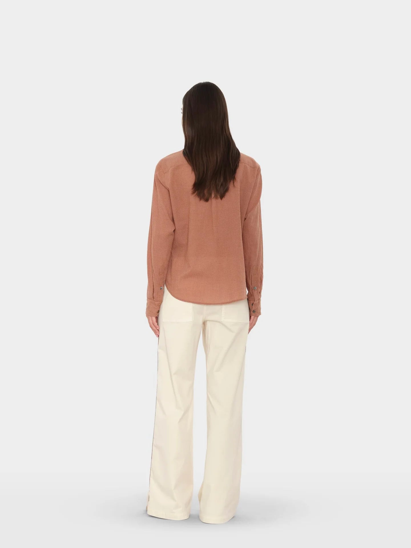 Xirena Bradshaw Pant with brown long-sleeve shirt, modern minimal style, neutral backdrop.