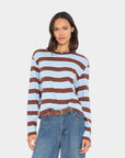 Xirena Terrance Tee in vintage-inspired striped cotton, boxy fit, styled with blue jeans and a brown belt.