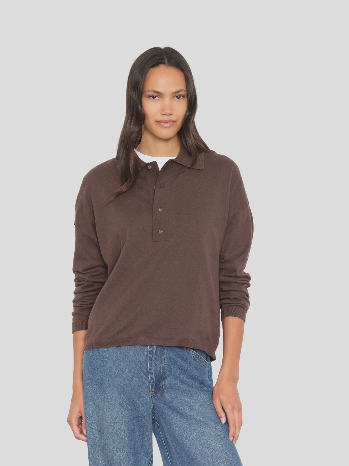 Xirena Collin Sweater in cream paired with blue jeans, shown on model against a light gray background.