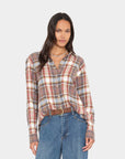 Xirena Beau Shirt in Canyon Brown styled with blue jeans, shown on model against a simple background.