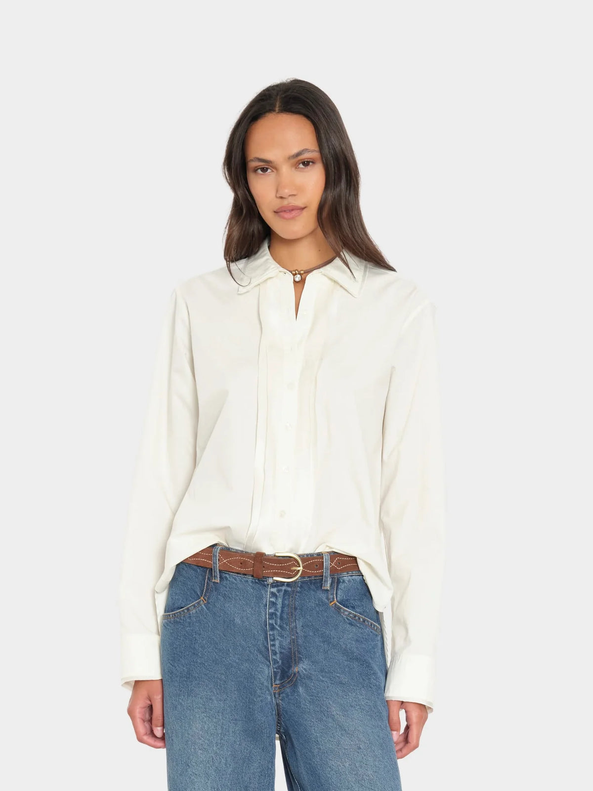 Ivory Beau Shirt by Xirena paired with blue jeans, modern casual look against a simple light background.