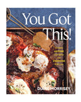 The cover of "You Got This" by Simon & Schuster Inc. shows a cheesy baked chicken dish with basil, highlighting simple recipes—easy meals anyone can cook and everyone will love.
