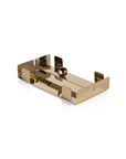 The Zodax IN-8194 Dinner Napkin Holder Gold is a modern, rectangular metal tray with raised sides and a central round gold knob handle—perfect as a chic napkin holder or bar accessory, shown on a white background.