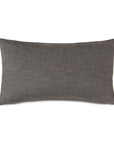 A Zephyr Engraved 15x26" lumbar pillow in a textured charcoal grey fabric, styled with an understated elegance, suitable for accenting minimalist bungalow decor by Eastern Accents.