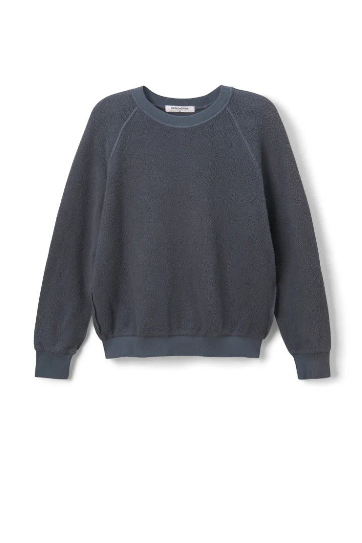 The Ziggy Reverse LS Sweatshirt by Perfectwhitetee is a long-sleeve, crew-neck top in dark grayish-blue soft cotton fleece, featuring bracelet-length sleeves and ribbed cuffs, hem, and neckline for comfort and style.