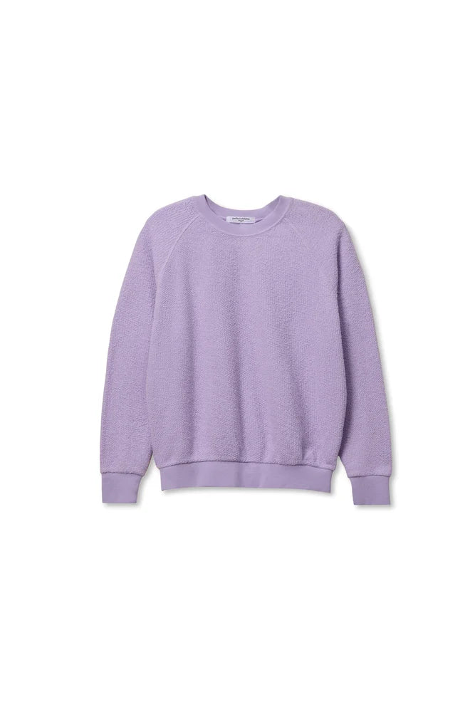 The Ziggy Reverse LS Sweatshirt by Perfectwhitetee is a light purple cotton fleece with bracelet-length sleeves and ribbed cuffs, hem, and neckline, shown against a plain white background.