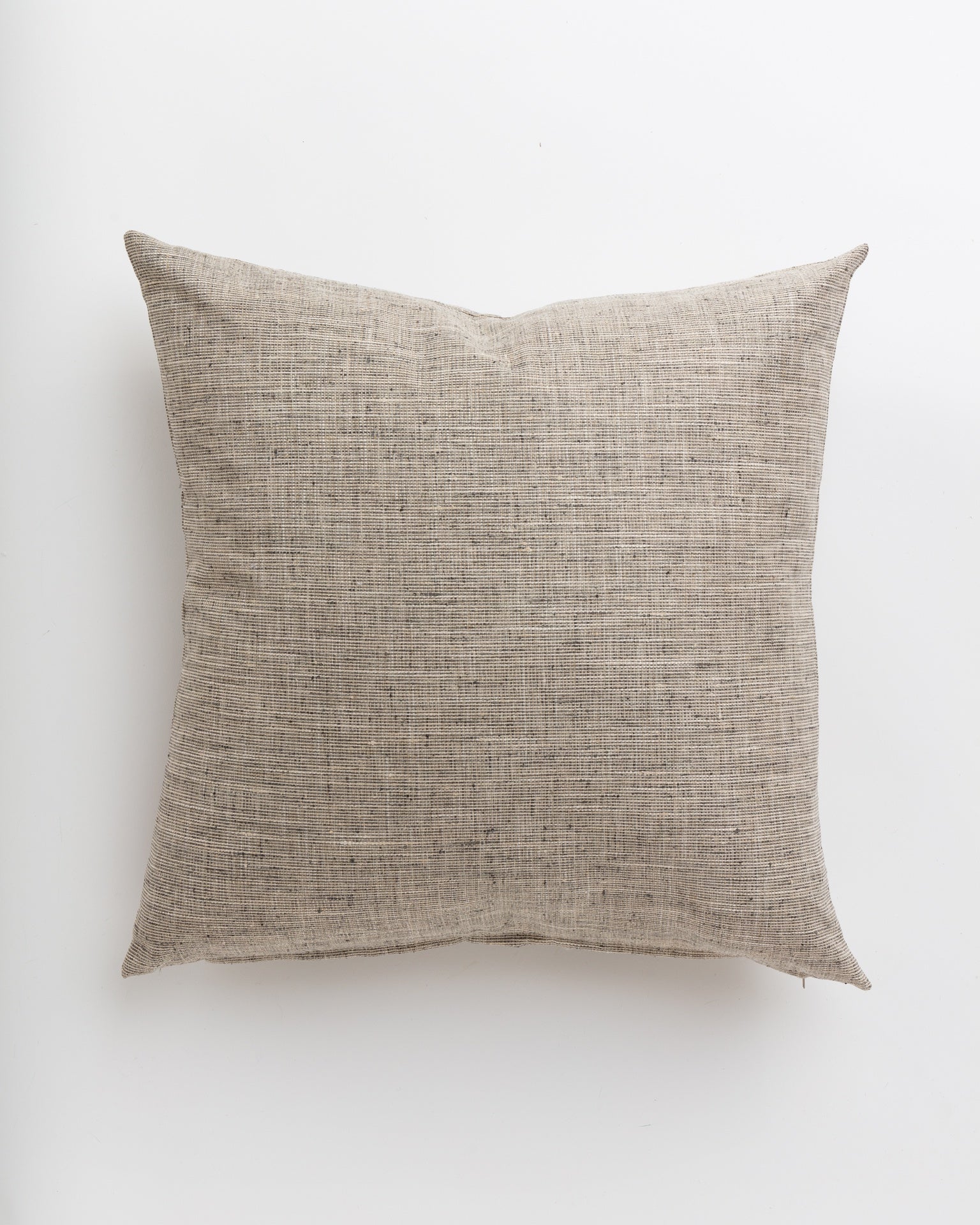 A simple Grasscloth Steel 24x24&quot; throw pillow by Gabby, designed for a Scottsdale bungalow, lying flat against a white background. The texture of the fabric is prominently visible, highlighting its natural, coarse weave.