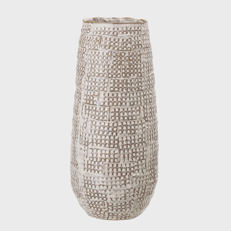 A tall, cylindrical stoneware vase from Bloomingville with a textured, basket-weave pattern in white and beige colors, perfect for a bungalow in Scottsdale, Arizona, isolated on a white background.