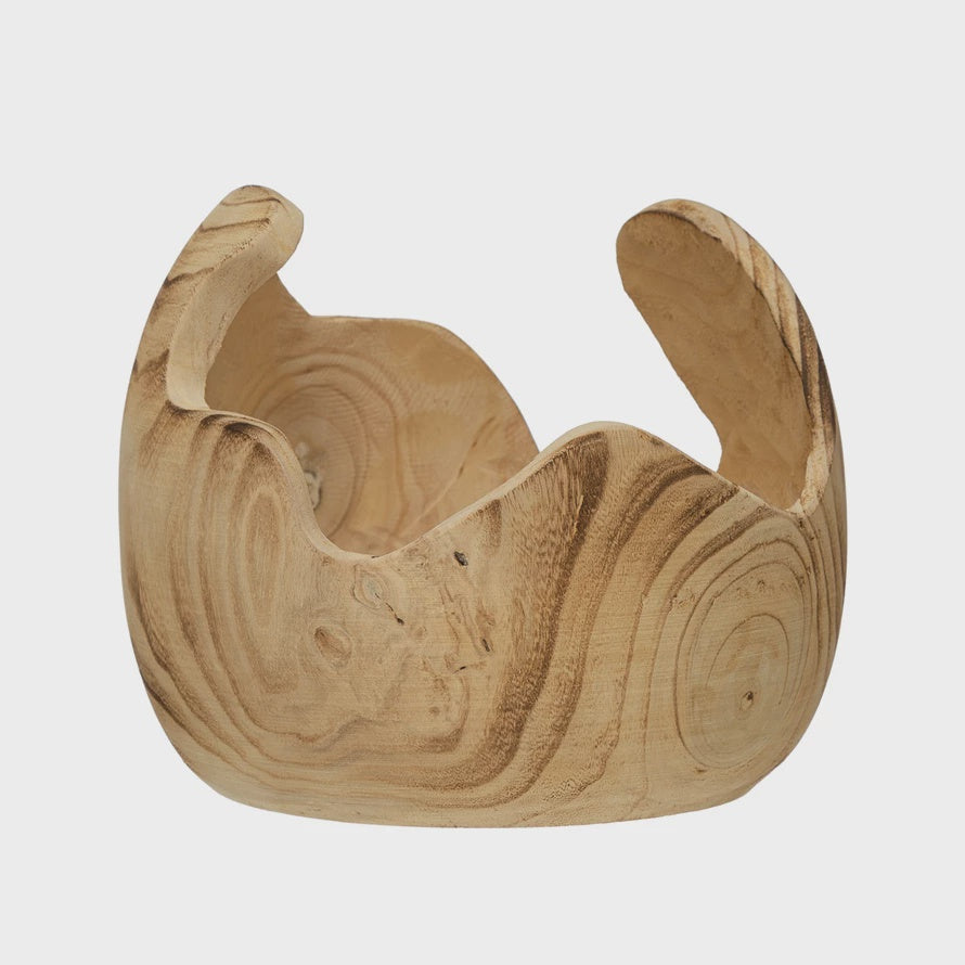 A Bloomingville Organic Paulownia Wood Bowl with a unique, wavy rim, showing natural wood grain patterns from Scottsdale, Arizona, isolated on a white background.