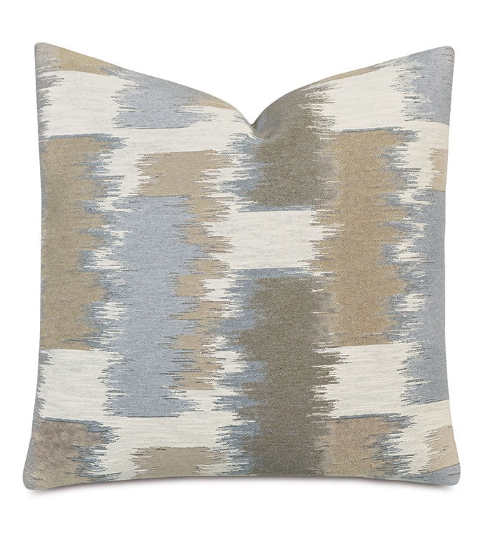 Decorative Shea Woven throw pillow with an abstract design in muted shades of blue, gray, and beige, suitable for a Scottsdale bungalow, displayed against a plain white background.